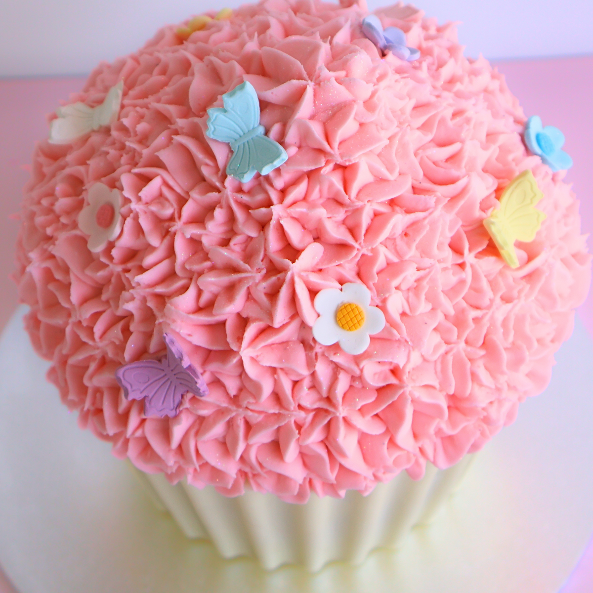 Pink Vanilla Giant Cupcake Cake with Butterflies and Blossom Flowers